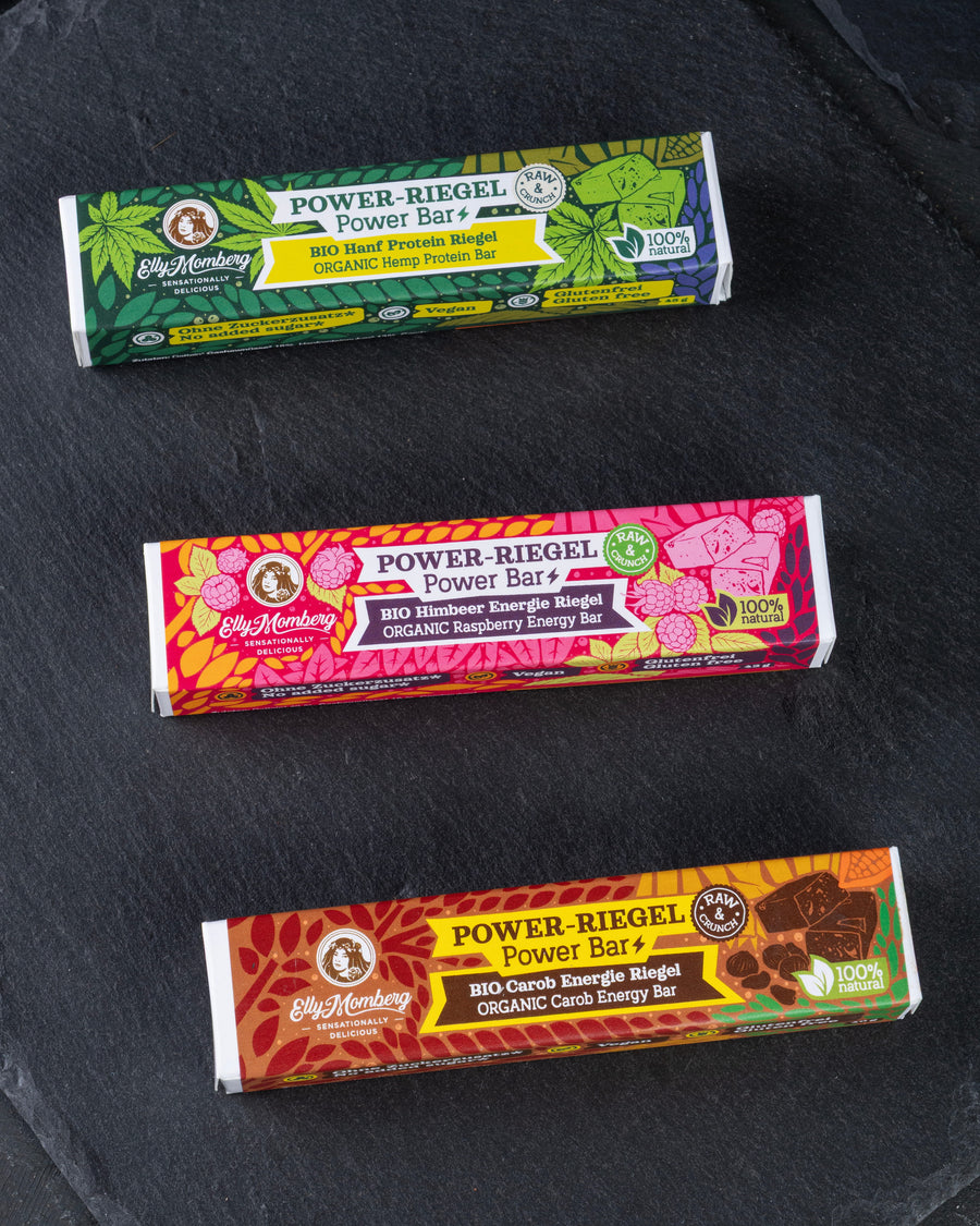 Energie Riegel, Power, Rohkost, Protein, Eiweiß, Pre Workout, Sport, Fitness, laktosefrei, vegan, glutenfrei, ohne Zuckerzusatz, Carob, Johannisbrotkernbaum, Dattel, Elly Momberg, Bio, Organic, Hanf, Himbeer, Haselnüsse
