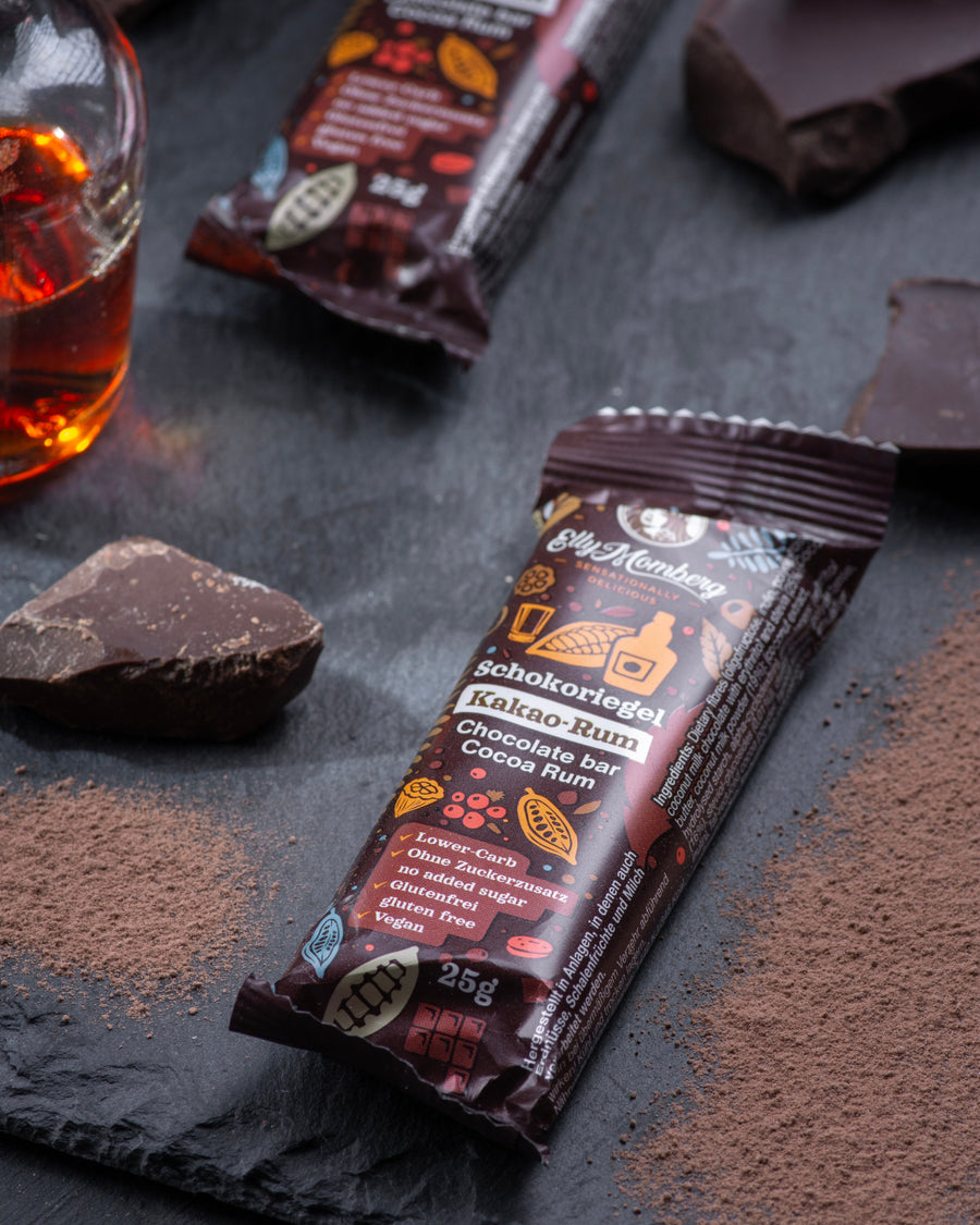 Chocolate gourmet bar with a cross-section on a dark surface with cocoa rum, sugar free, vegan, gluten free, keto. lowert carb, diabetics
