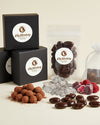 Assorted chocolate products with Elly Momberg branding on a light background
