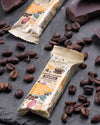 Chocolate bar with a cross-section on a dark surface with coffee beans, sugar free, vegan, gluten free, keto. lowert carb, diabetics