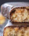 Chocolate peanut caramel gourmet bar with a cross-section with peanuts, sugar free, no added sugar, vegan, gluten free, keto. lower carb, diabetics