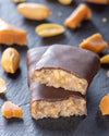 Chocolate peanut caramel gourmet bar with a cross-section with peanuts, sugar free, no added sugar, vegan, gluten free, keto. lower carb, diabetics