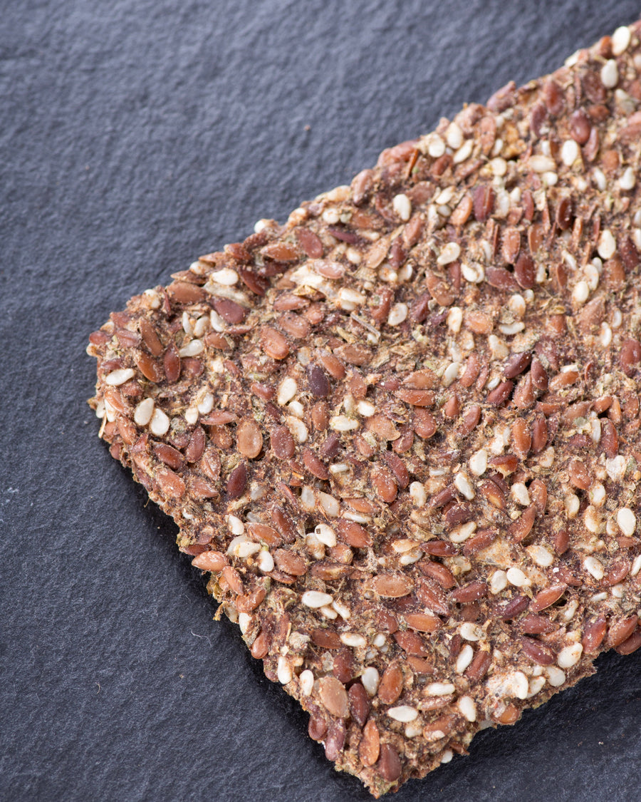 Seed cracker on dark slate surface