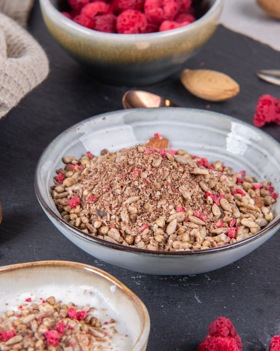 Elly Momberg Organic Raw quality granola with  buckwheat, sunflower seeds, carob, raspberry and almonds, no added sugar, gluten free, vegan