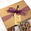 Elly Momberg gift box purple ribbon 